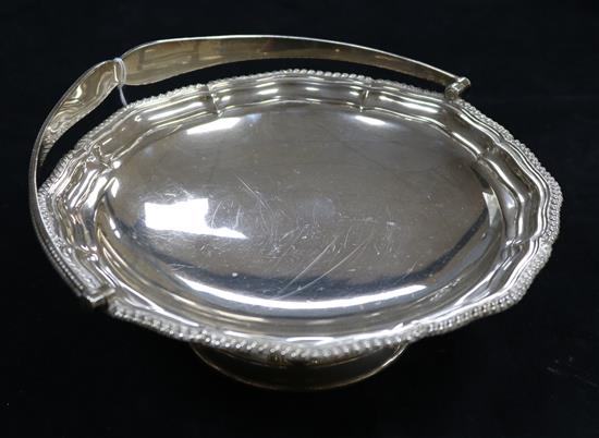 A silver swing-handled cake basket, with gadroon edges, Sheffield 1923, James Deakin & Sons, 13.4oz